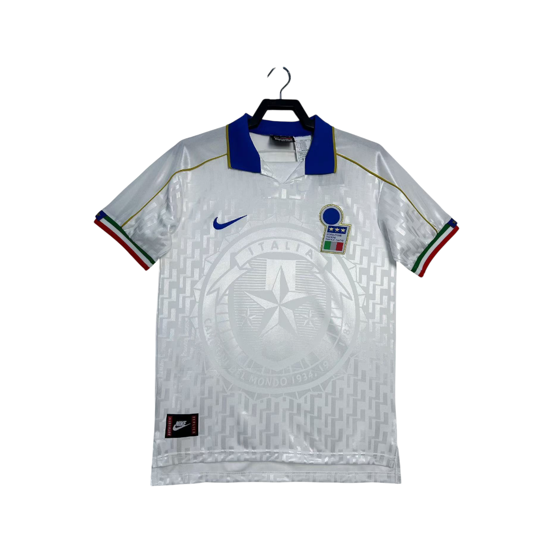White sports jersey with blue and red accents on a hanger against a white background
