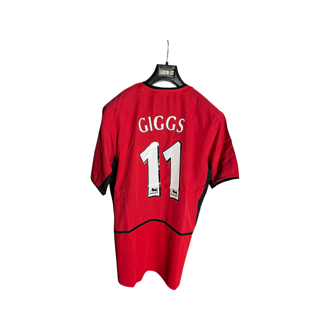 Red sports jersey with 'GIGGS' and number '11' on a white background