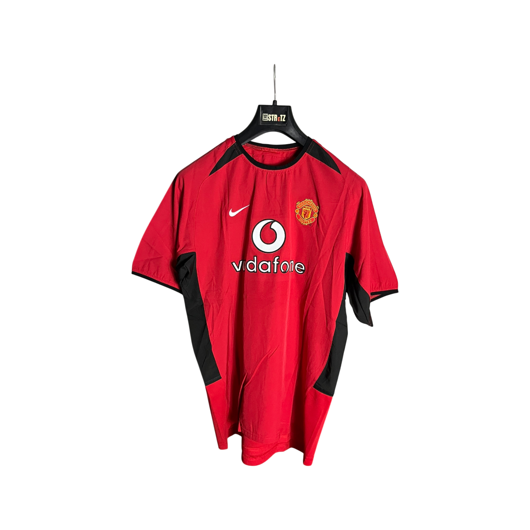 Red sports jersey with black accents on a hanger against a white background