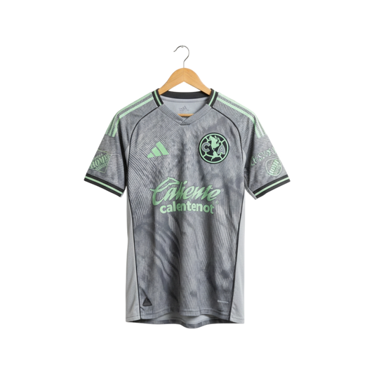 Gray sports jersey with green accents on a hanger against a white background