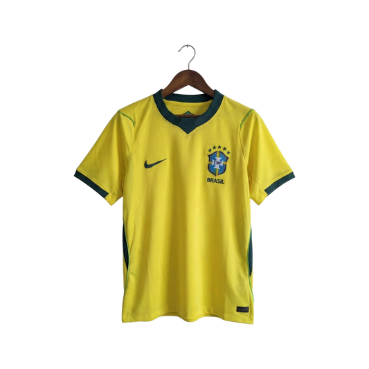 Yellow soccer jersey with green accents on a hanger against a white background