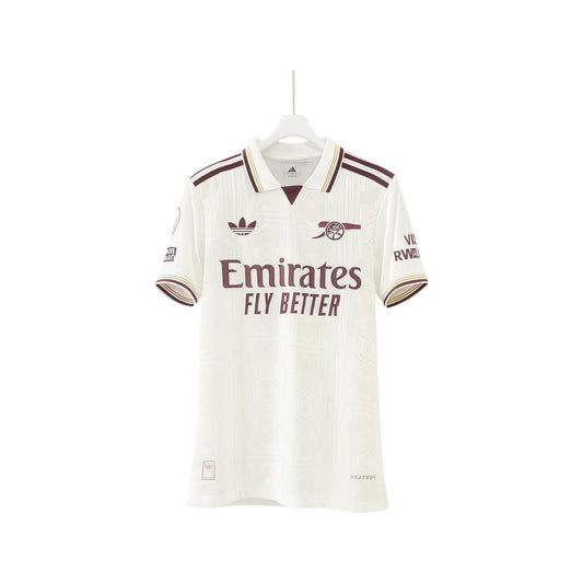 White sports jersey with Adidas logo and 'Emirates Fly Better' text on a white background
