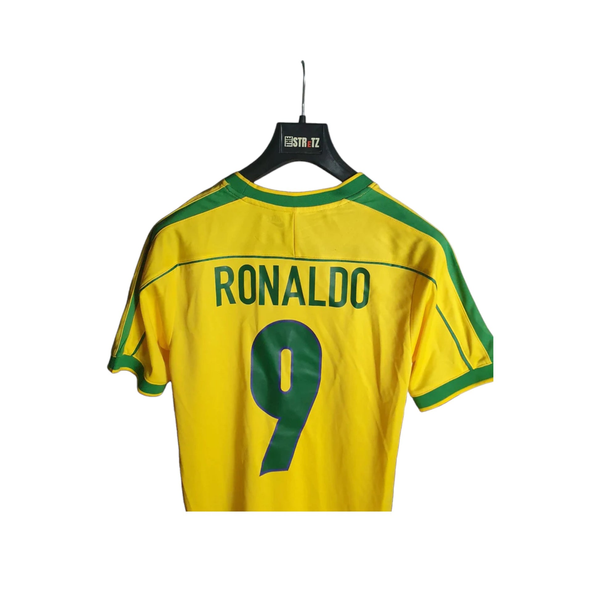 Brazil Home Yellow Football jersey with 'RONALDO' and number '9' on a hanger against a white background