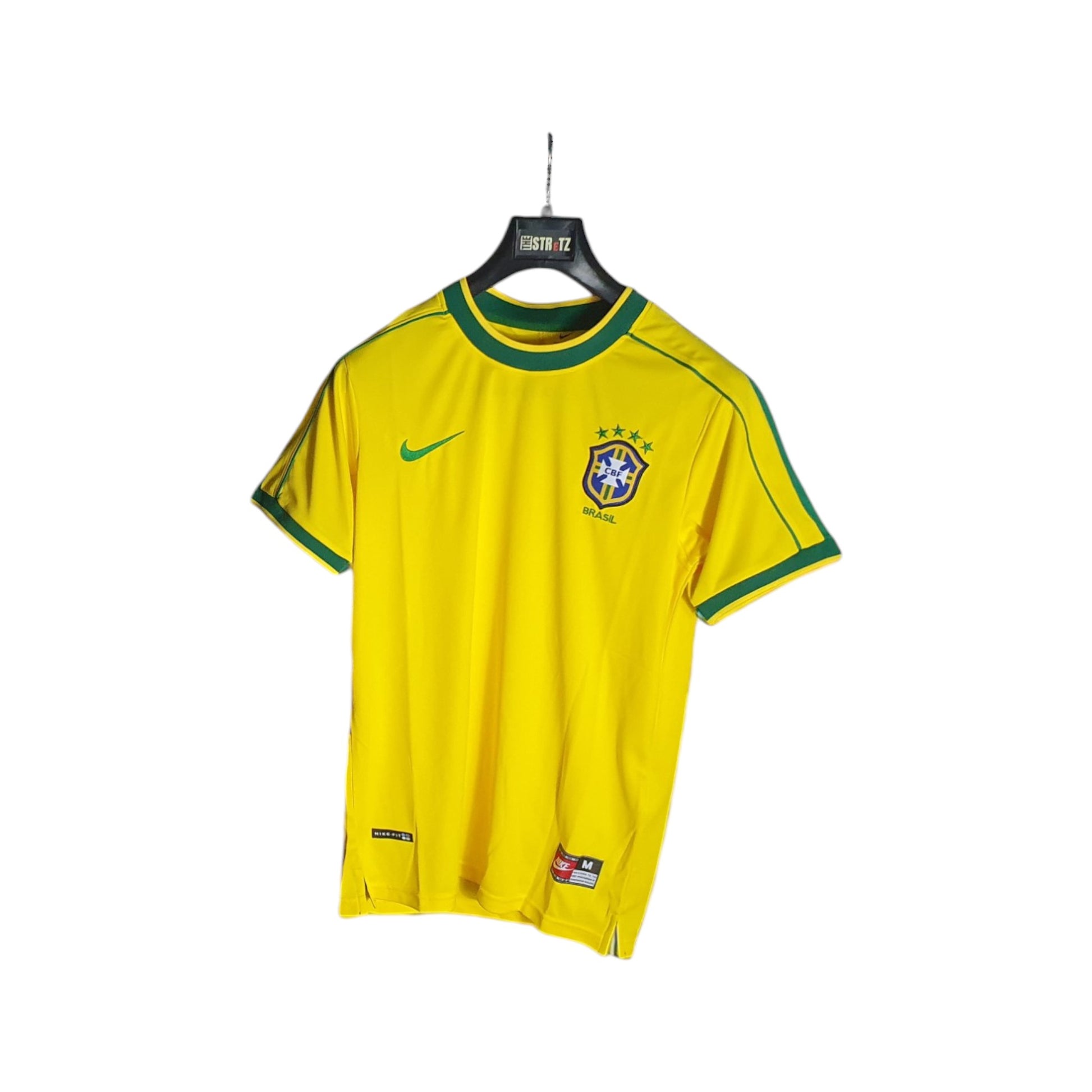 Brazil football jersey with green accents on a hanger against a white background