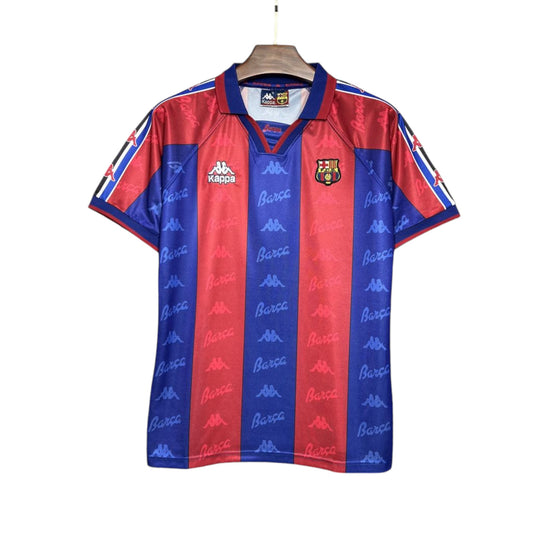 FC Barcelona 1995/1996 home jersey with blue and red stripes, displayed on a hanger.