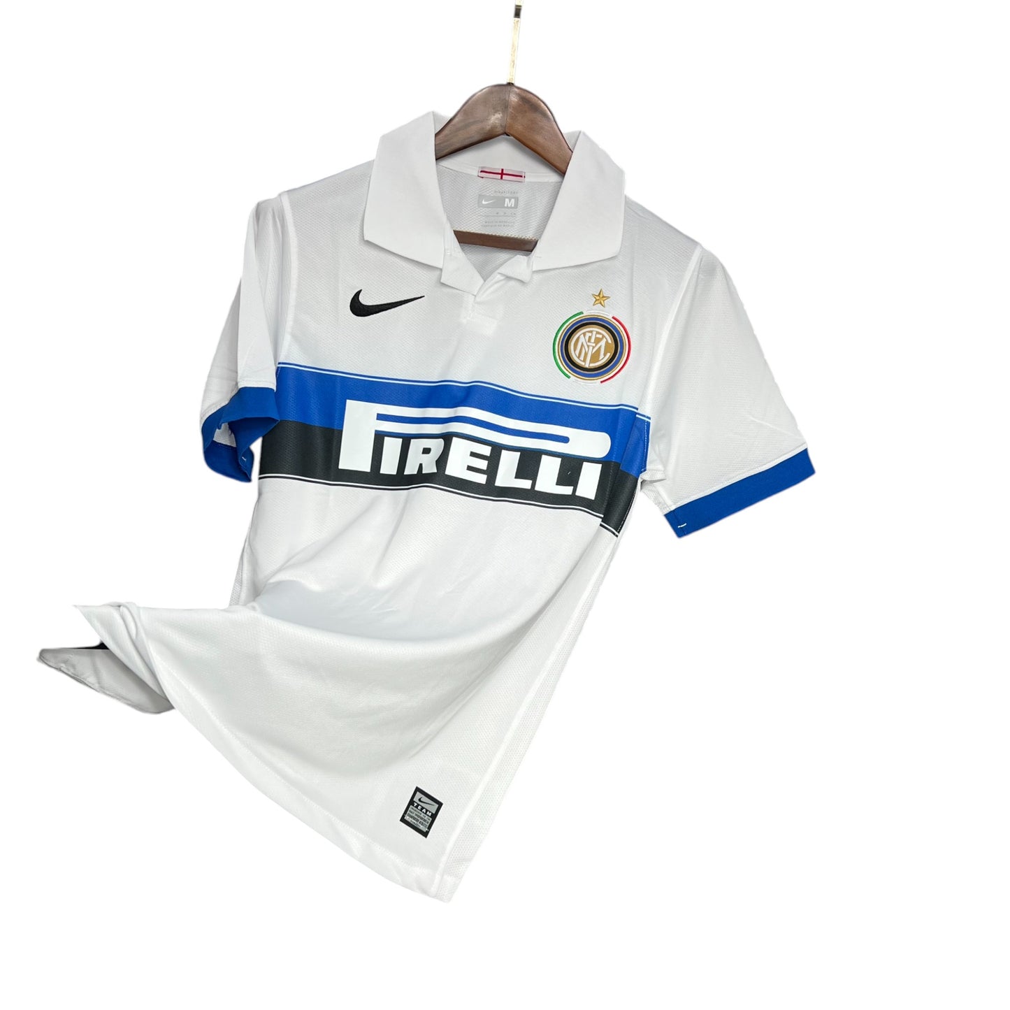 Inter Milan 2009/2010 Away Jersey displayed on a wooden hanger, featuring a white base with blue and black accents, and the Nike logo.