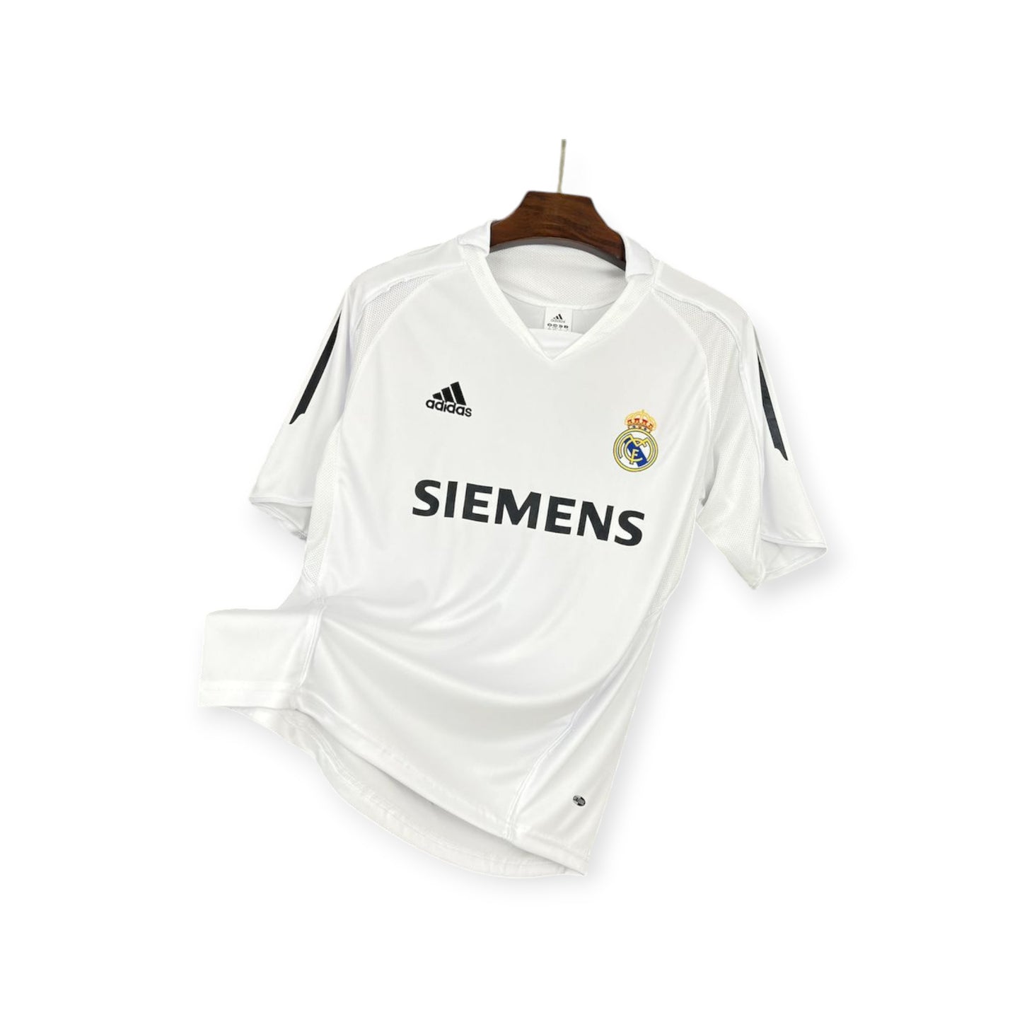 Real Madrid 2005/2006 Home Jersey displayed on a mannequin, predominantly white with blue details, Adidas branding, and Siemens sponsor logo.