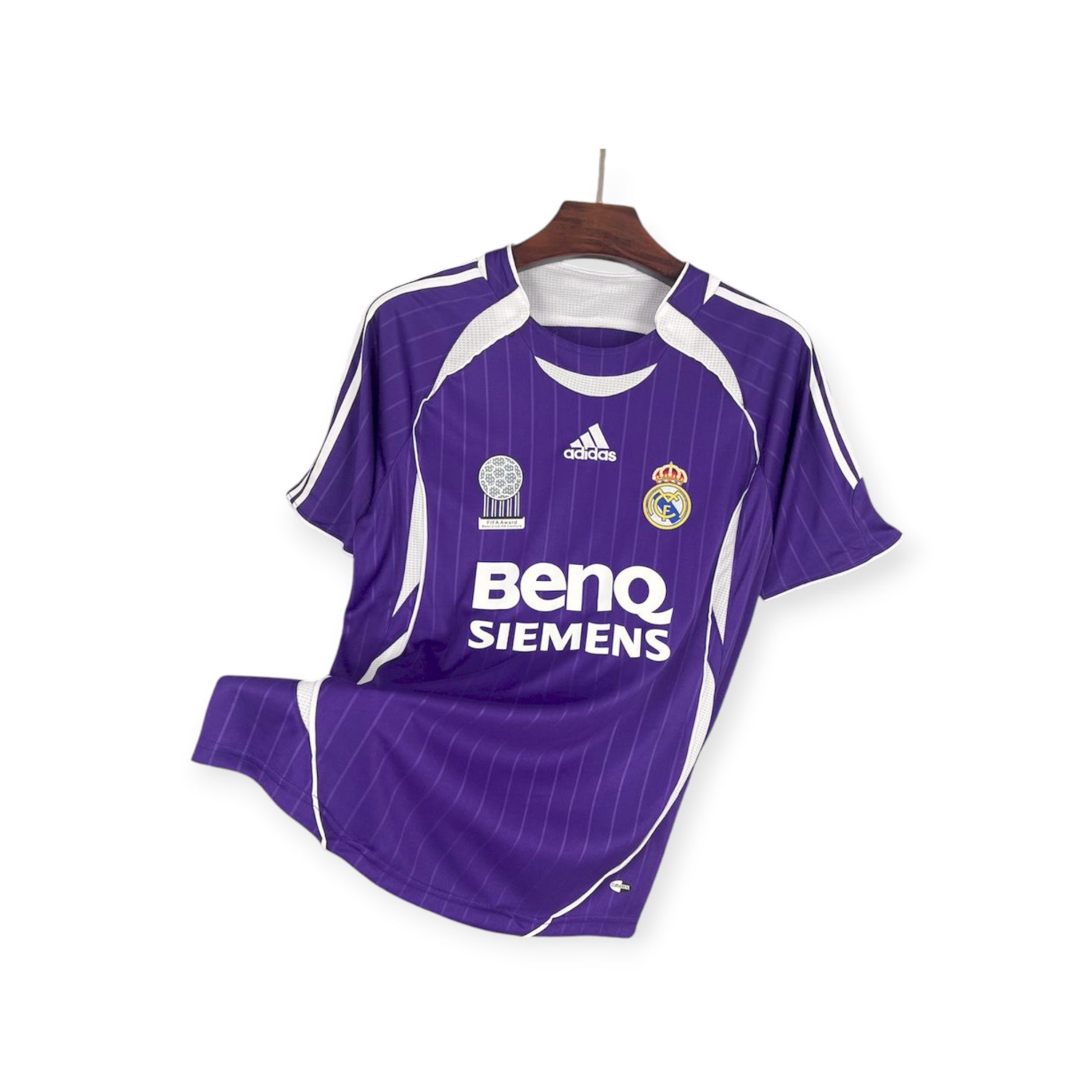 A purple and white striped Real Madrid 2005/2006 Home Jersey with the club's crest and sponsor logo displayed.