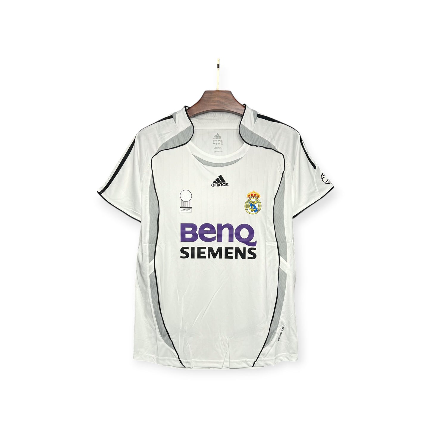 Real Madrid 2006/2007 Home Jersey displayed on a hanger, predominantly white with black and gray accents, featuring the Adidas logo and BenQ Siemens sponsor branding.