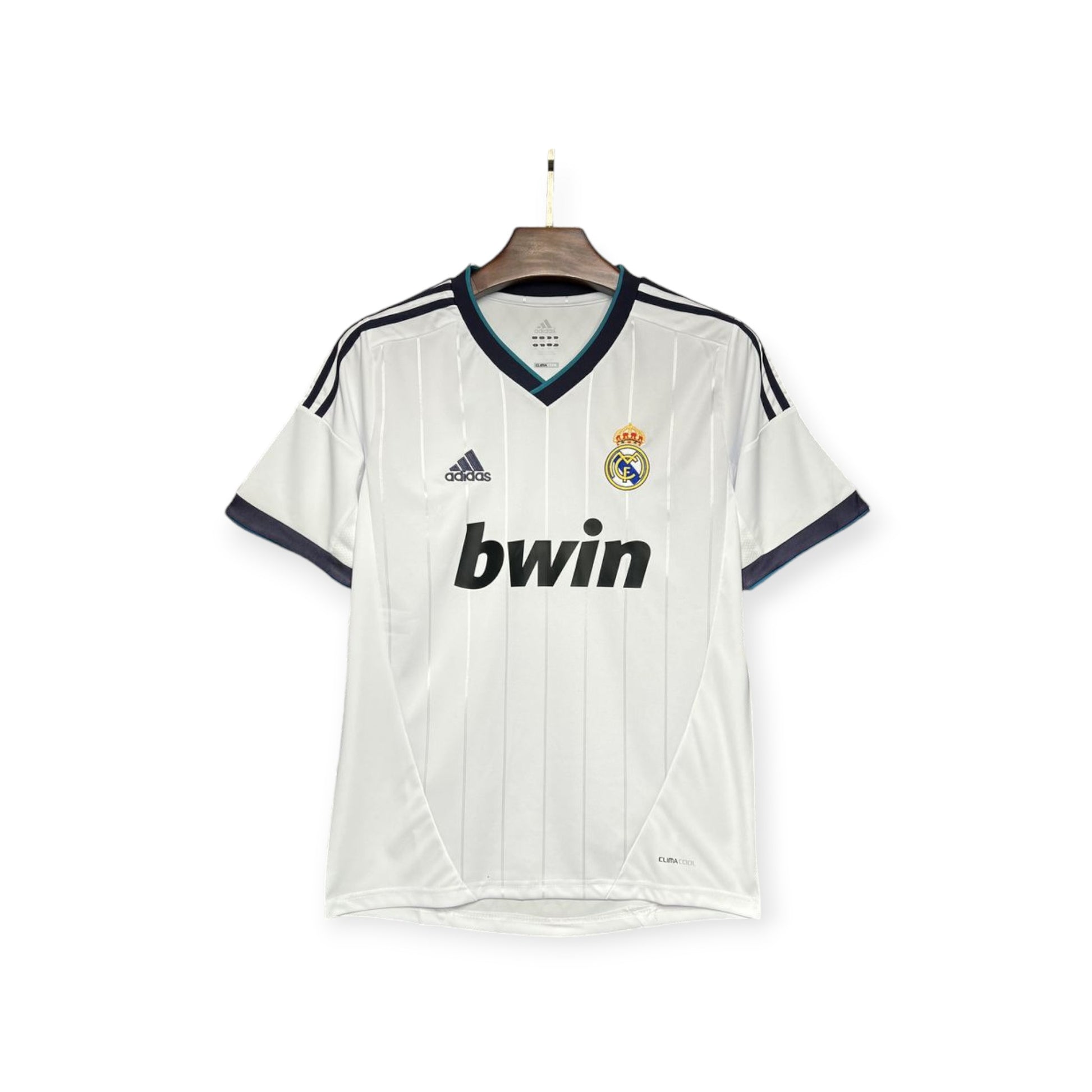 Real Madrid 2012/2013 Home Jersey displayed on a mannequin, featuring white color with blue and black accents, the club crest, and the bwin sponsor logo.